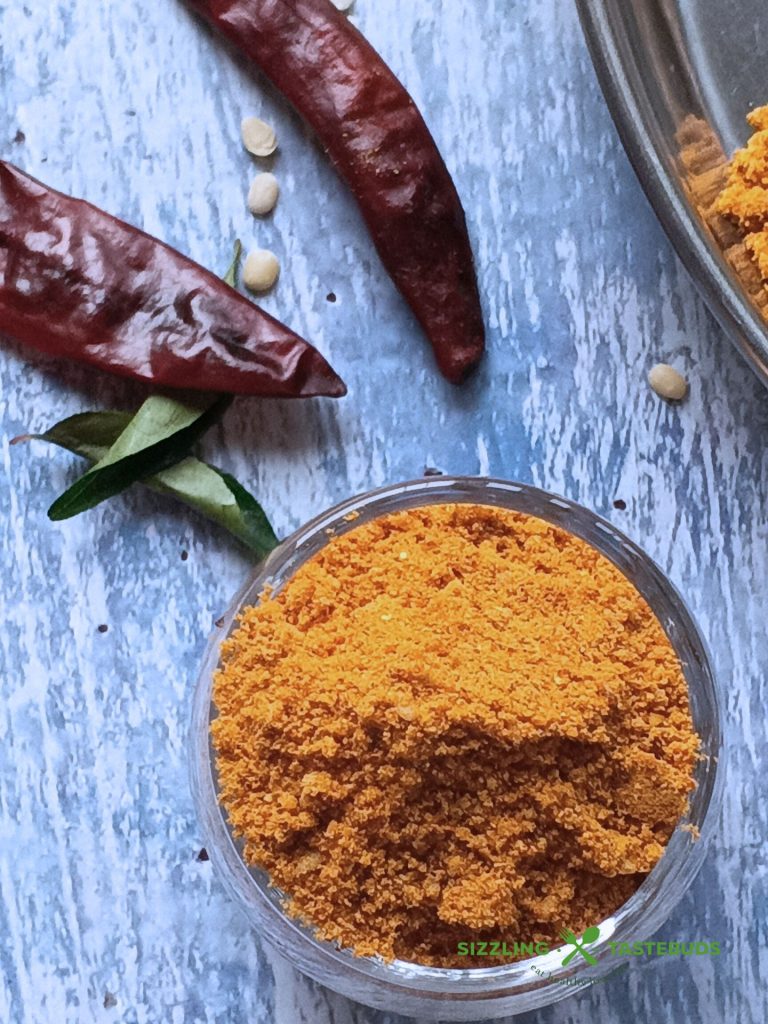 Molagapudi, or "gunpowder," is a bold South Indian spice blend of roasted lentils and chillies, typically served with oil or ghee with Idli and Dosa.