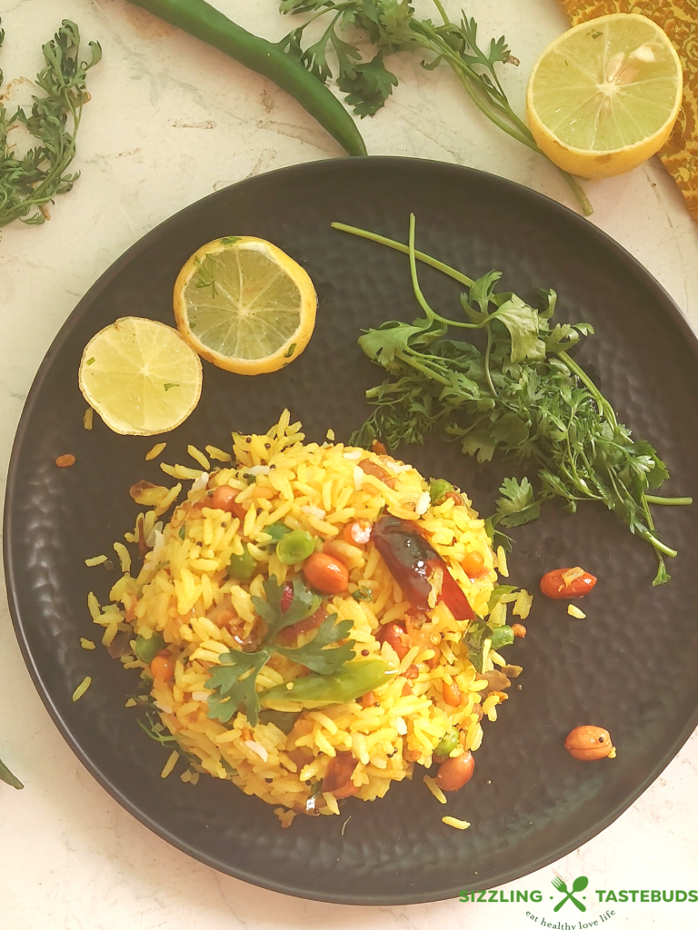 Lemon Rice is a South Indian flavoured rice with lemon and everyday spices - Gluten Free and Vegan, this is eaten for lunch or a quick snack. Also makes an excellent lunchbox recipe.