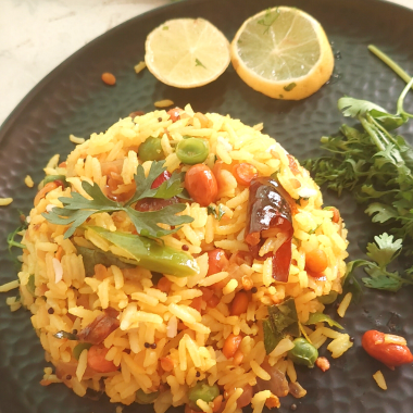 Lemon Rice is a South Indian flavoured rice with lemon and everyday spices - Gluten Free and Vegan, this is eaten for lunch or a quick snack. Also makes an excellent lunchbox recipe.