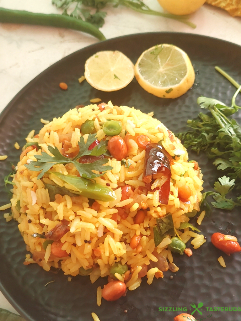 Lemon Rice is a South Indian flavoured rice with lemon and everyday spices - Gluten Free and Vegan, this is eaten for lunch or a quick snack. Also makes an excellent lunchbox recipe.