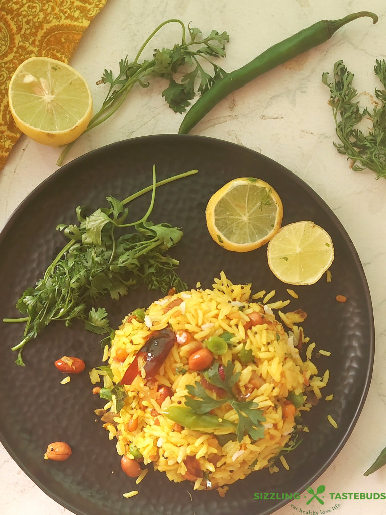 Lemon Rice is a South Indian flavoured rice with lemon and everyday spices - Gluten Free and Vegan, this is eaten for lunch or a quick snack. Also makes an excellent lunchbox recipe.