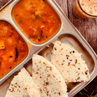 Pepper Idli or Milagu Idly is an Idli variant with whole peppercorns and spices added to the batter and steamed. Served with chutney or sambar