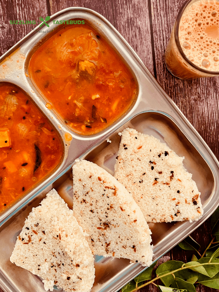 Pepper Idli or Milagu Idly is an Idli variant with whole peppercorns and spices added to the batter and steamed. Served with chutney or sambar