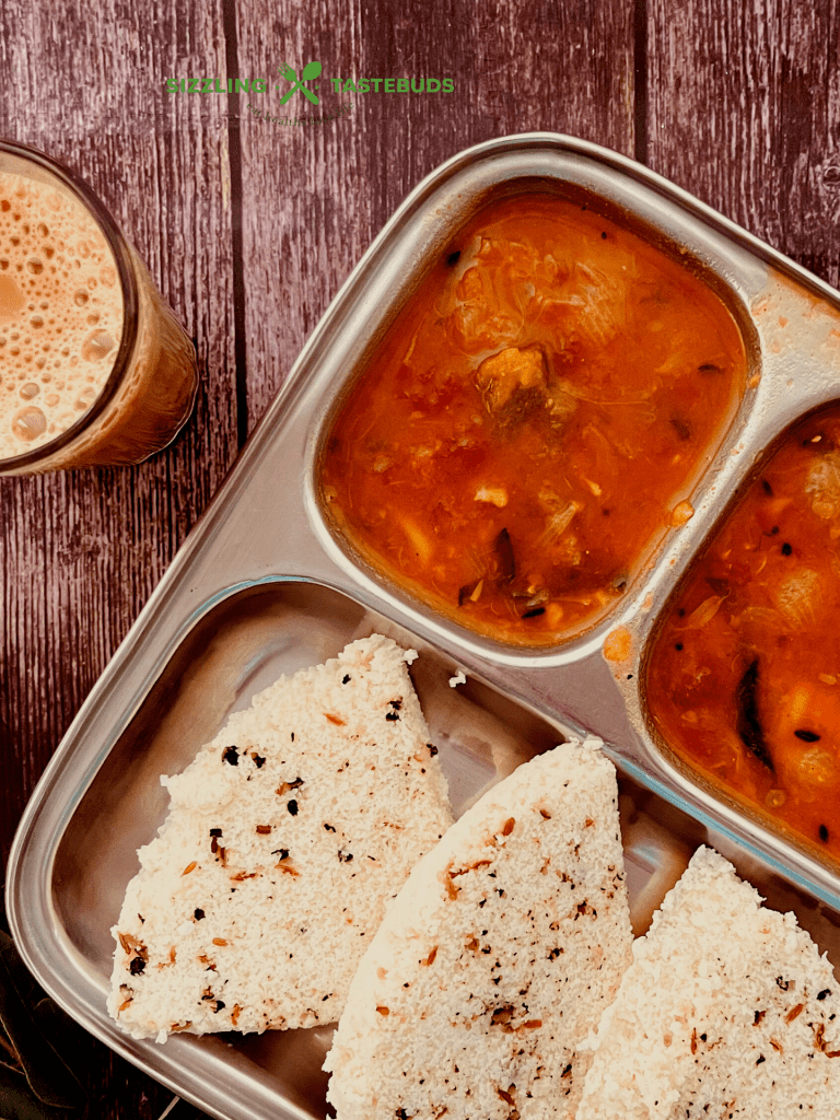 Pepper Idli or Milagu Idly is an Idli variant with whole peppercorns and spices added to the batter and steamed. Served with chutney or sambar