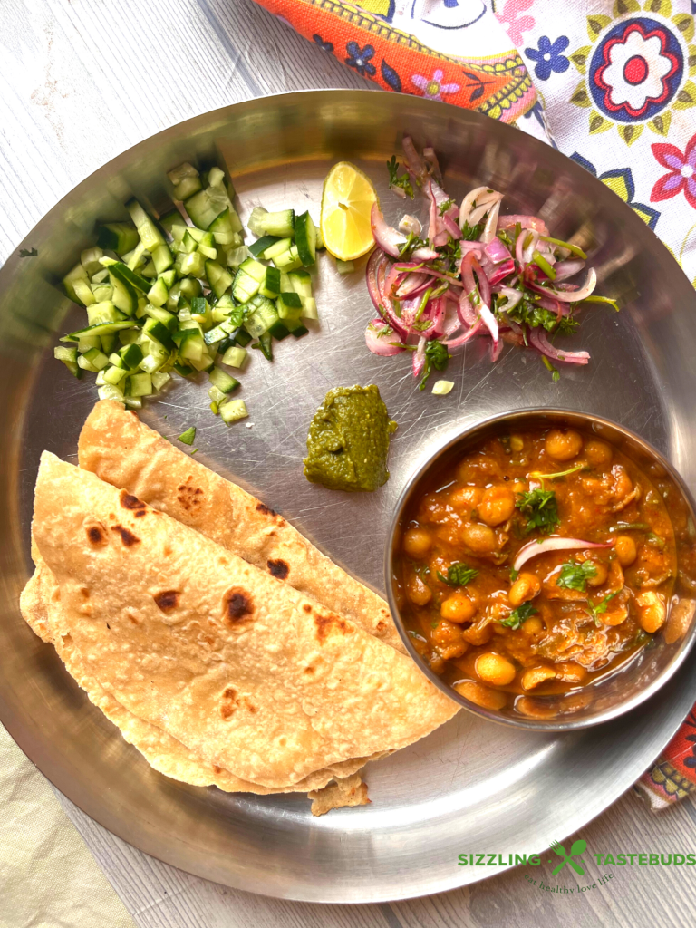 Safed Vatanyachi Usal is a curry made with rehydrated white peas slow cooked in a tangy spicy base. Served with Pav (bread rolls) or Roti (Flatbread).