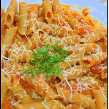 WholeWheat Penne Pasta in a creamy, cheesy homemade Arrabbiata sauce. Perfect for weeknight dinners or kids parties.
