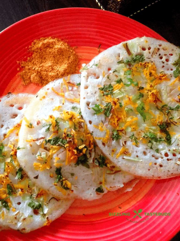 Thinai Uttapam or Foxtail Millet Uttapam is a thick dosa (savoury pancake) made with millets topped with vegetables. 100% Gluten Free and Vegan. Served as breakfast or snack.