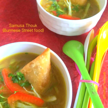 Samosa thouk is a Burmese street food delight blending chopped samosas with zesty vegetables and tangy dressing.