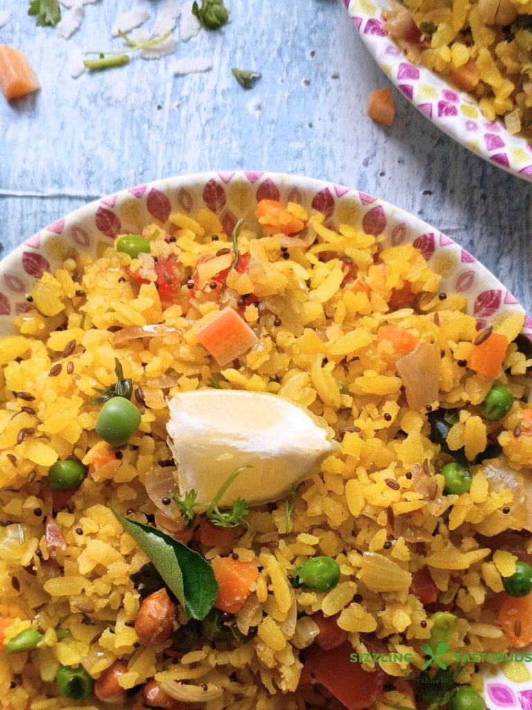 Vegetable Poha is a healthy and filling Gluten Free Vegan Breakfast or brunch dish made with flattened rice and lots of veggies. Perfect for lunchboxes too!