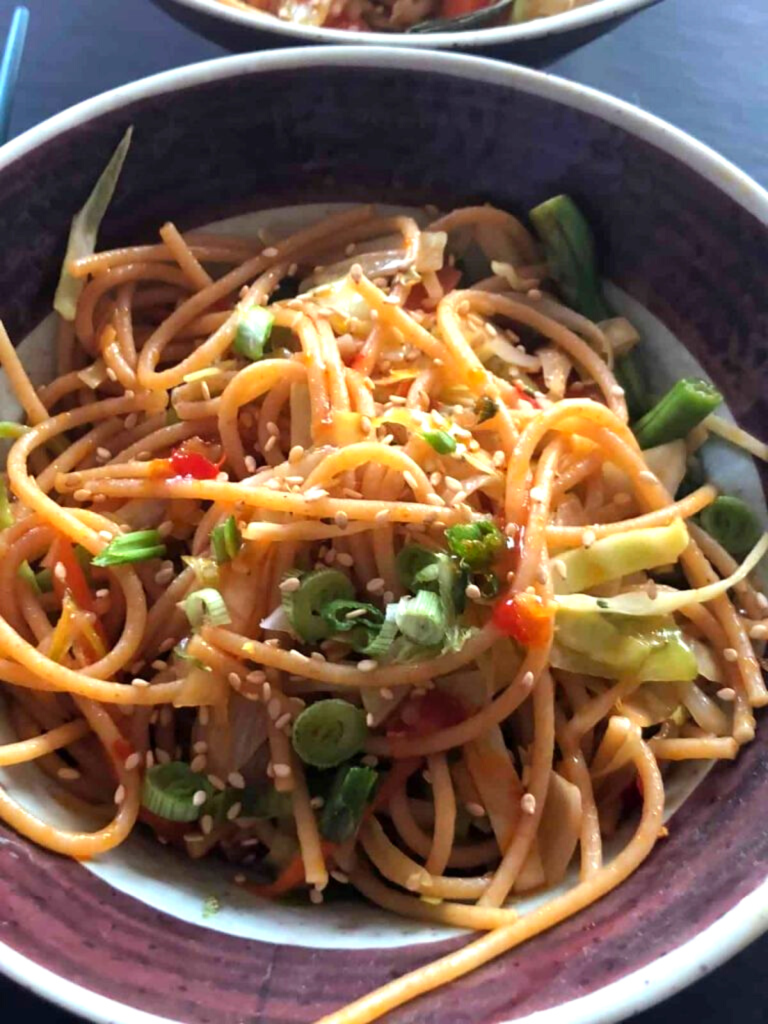Vegan udon stir-fry is a flavorful plant-based noodle dish with fresh vegetables, a spicy umami sauce and is perfect for a quick and healthy meal.