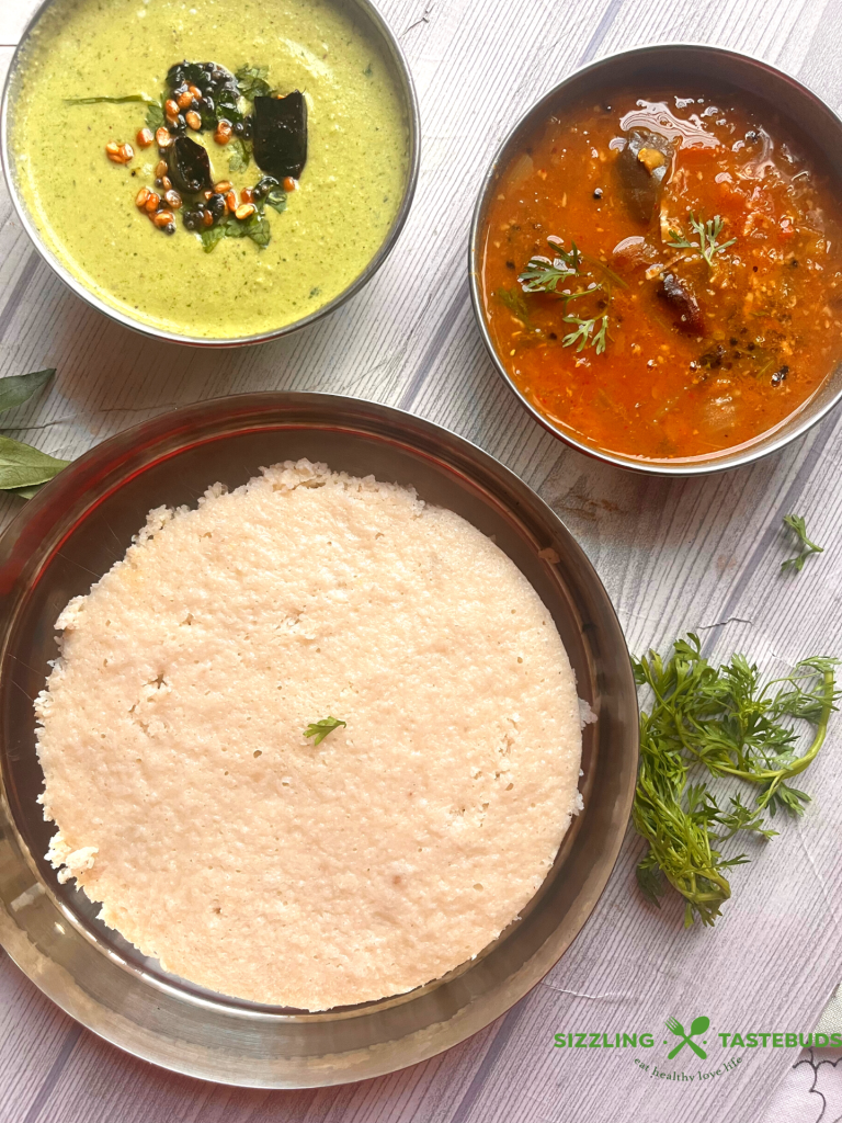 Thatte Idli is a famous gluten free,vegan breakfast dish from Bidadi (outskirts of Bangalore) where batter is steamed in leaf lined flat plates which gives its characteristic shape and softness 