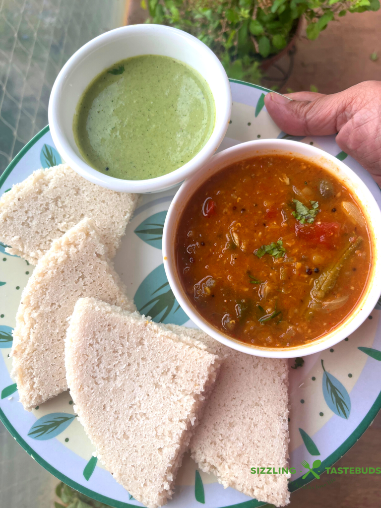 Thatte Idli is a famous gluten free,vegan breakfast dish from Bidadi (outskirts of Bangalore) where batter is steamed in leaf lined flat plates which gives its characteristic shape and softness