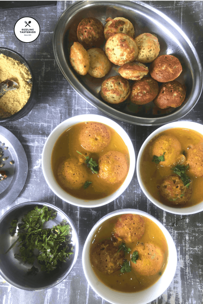 Darshini Style Bonda Soup is a protein rich Snack / Appetiser which is NOT deep fried. The lentil dumplings are served in an aromatic soup like broth