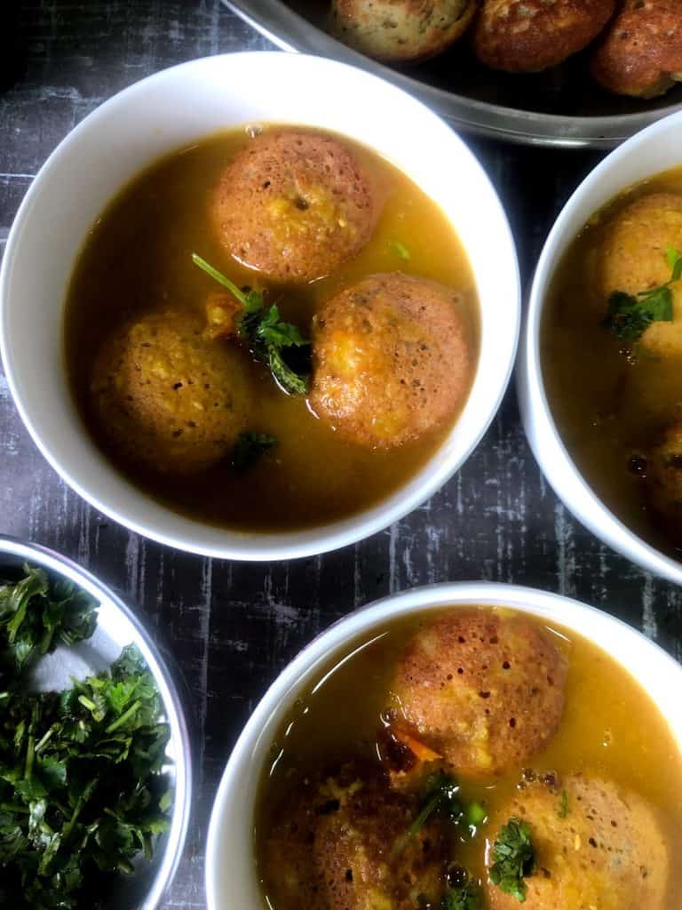 Darshini Style Bonda Soup is a protein rich Snack / Appetiser which is NOT deep fried. The lentil dumplings are served in an aromatic soup like broth