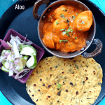 Punjabi style Dum aloo is a low fat, Gluten Free and Vegan Punjabi style gravy with Baby Potatoes, served with flatbread or steamed rice.