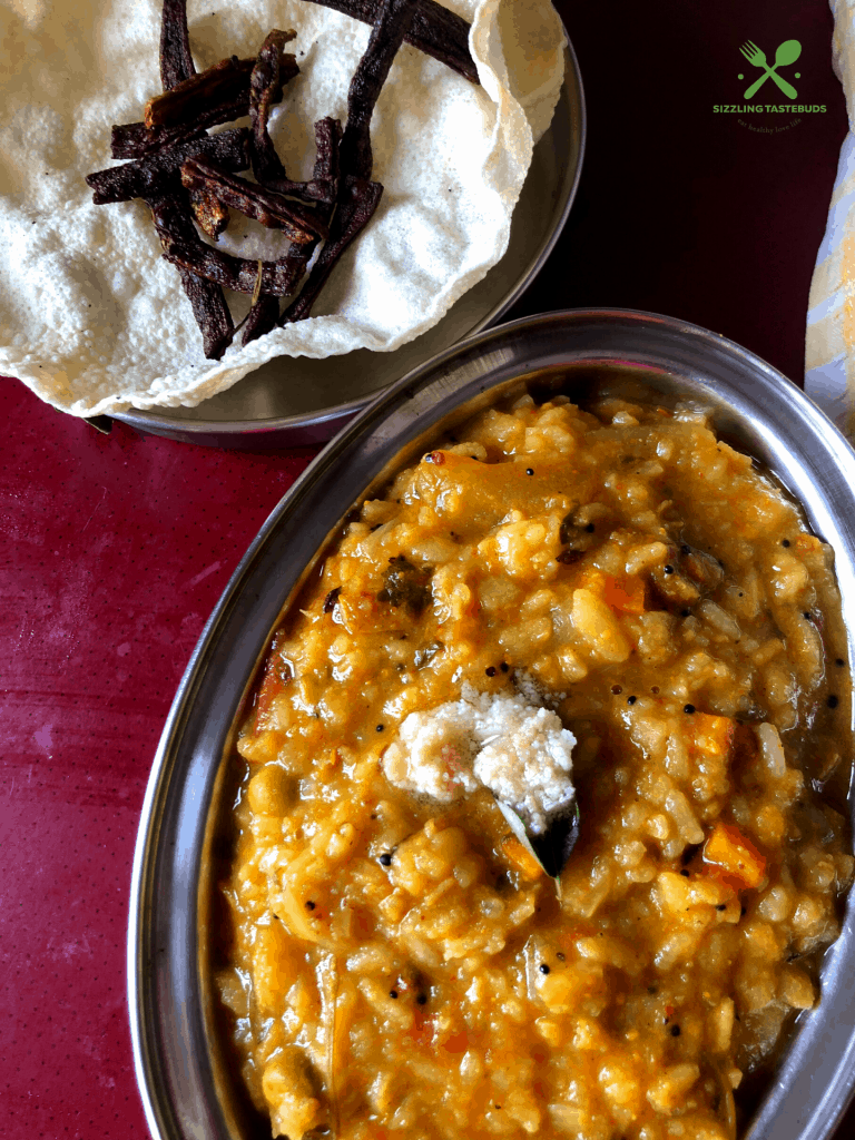 A Karnataka special One Pot Meal made with Lentils, veggies and flattened rice spiced with an aromatic powder.  