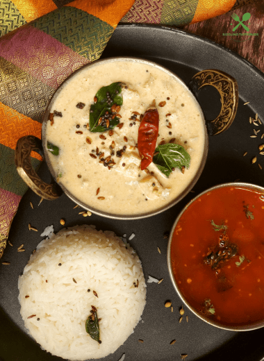 Vazhai Thandu Mor Kootu is a spiced curry made with yoghurt and tender banana stem. This is usually served with Sambhar and steamed rice.