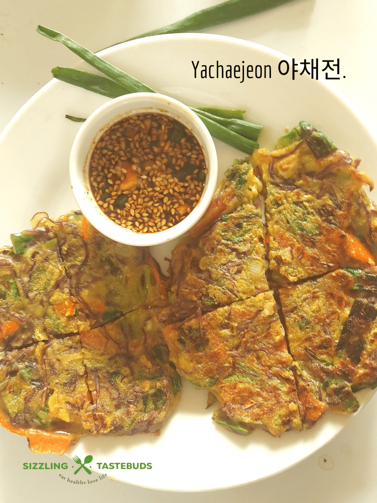 Vegan Yachaejeon (Korean pancakes) are savoury pancakes loaded with veggies and served with a dipping sauce. Can be served for breakfast or snack