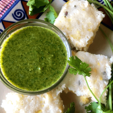 Brown Rice Corn Dhokla is a Gluten free steamed snack, made from Brown Rice and Corn. Served with Mint - Coriander Chutney