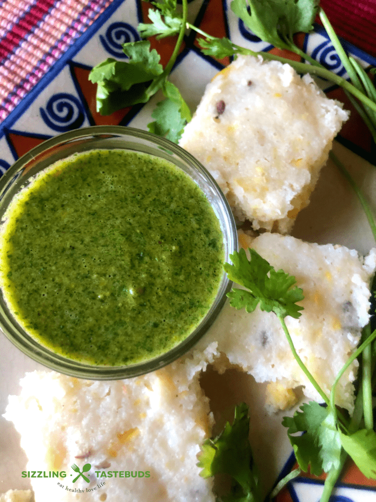 Brown Rice Corn Dhokla is a Gluten free steamed snack, made from Brown Rice and Corn. Served with Mint - Coriander Chutney