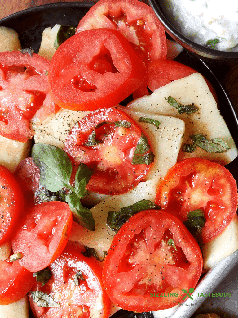A Summer delight, Caprese salad is a quick, delicious Italian salad or a side which uses Juicy Tomatoes and Mozzarella with other basic ingredients