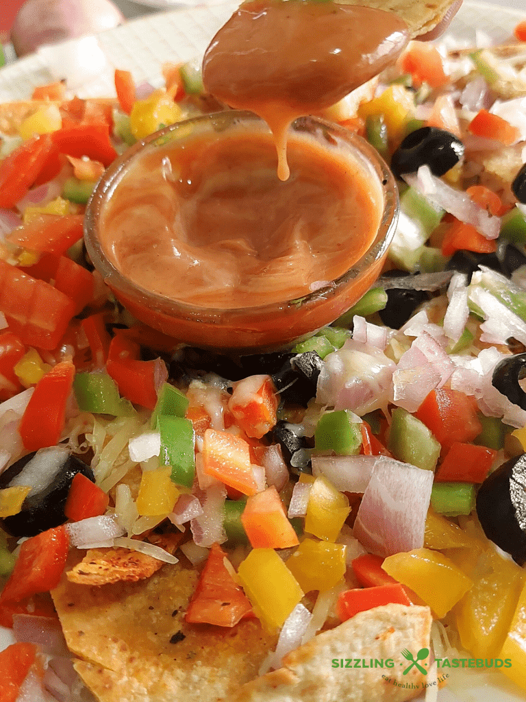 Baked Roti Nachos is a quick fusion snack made with left rotis (Indian Flatbread). Indo-mex fusion that is a great hit at parties or potluck