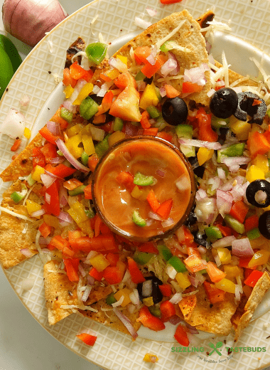 Baked Roti Nachos is a quick fusion snack made with left rotis (Indian Flatbread). Indo-mex fusion that is a great hit at parties or potluck