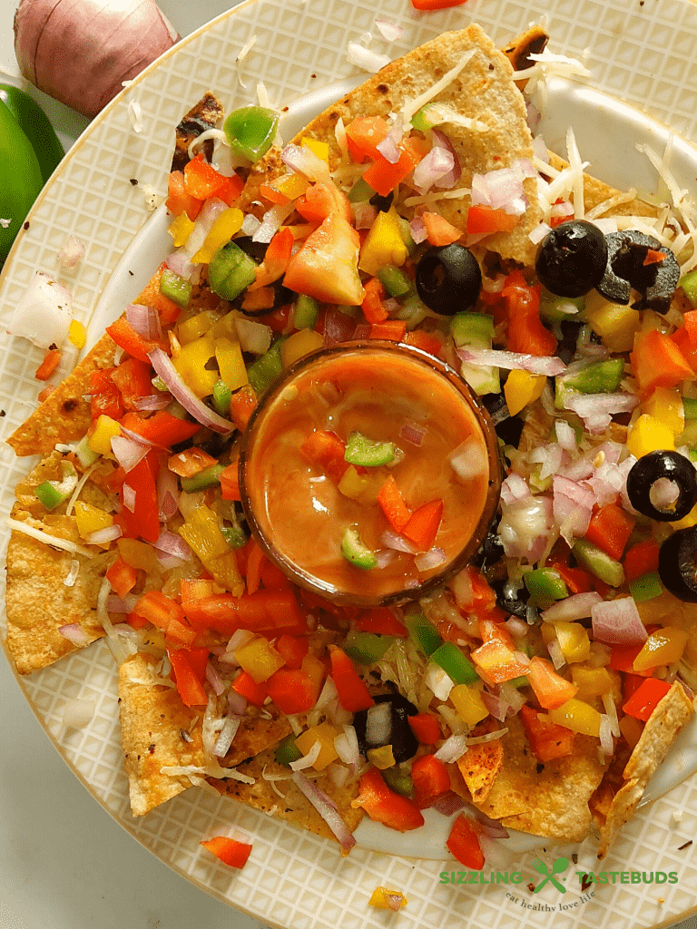 Baked Roti Nachos is a quick fusion snack made with left rotis (Indian Flatbread). Indo-mex fusion that is a great hit at parties or potluck