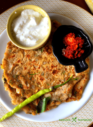 Masala Alu Paratha is a delicious and filling Spiced Potato flatbread, shallow fried in a pan., Served with Yogurt / pickle for breakfast, lunch or dinner