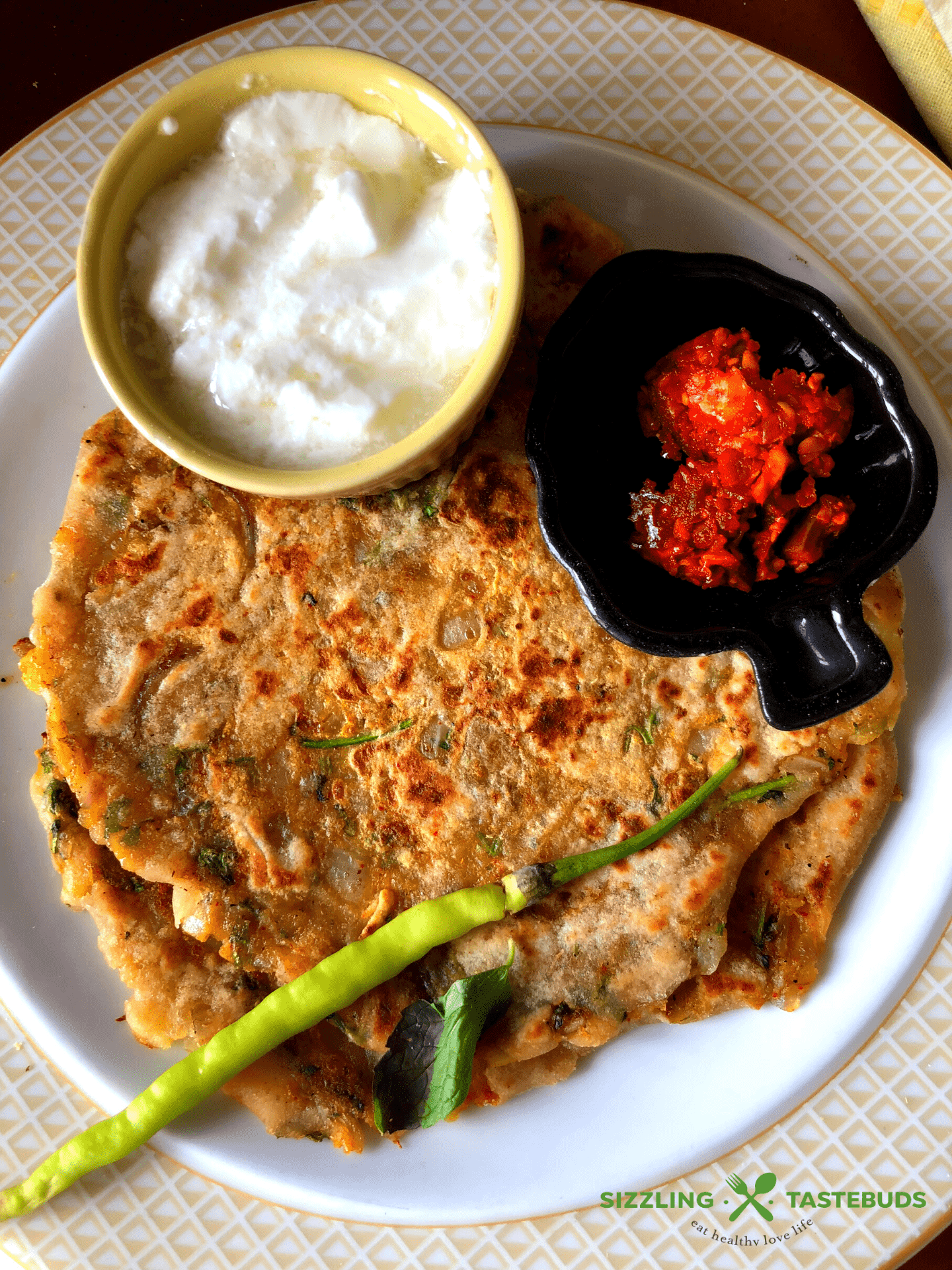 Masala Alu Paratha is a delicious and filling Spiced Potato flatbread, shallow fried in a pan., Served with Yogurt / pickle for breakfast, lunch or dinner