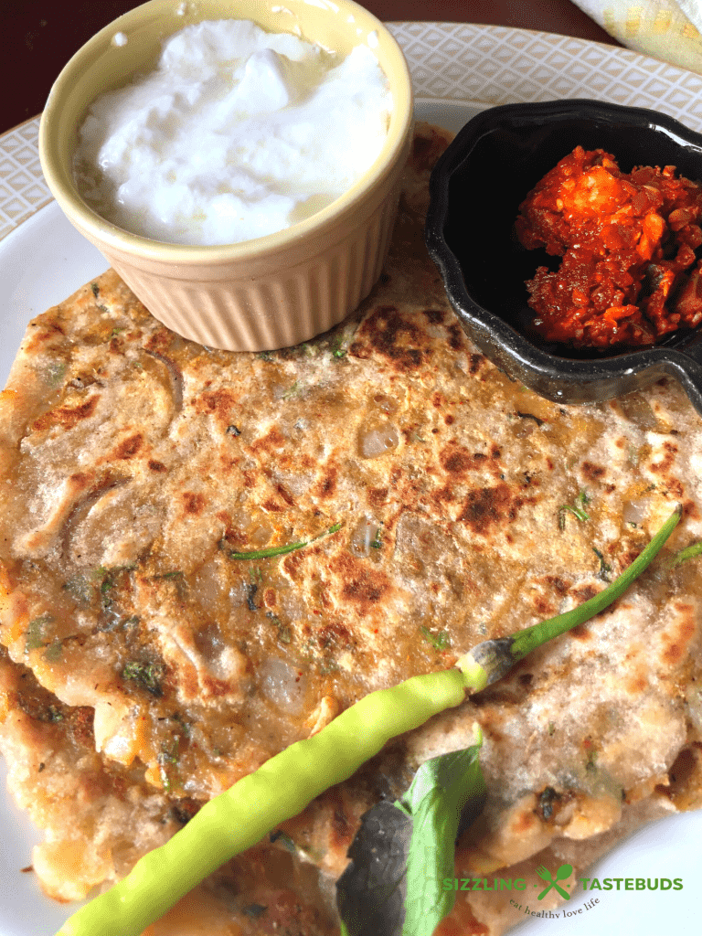 Masala Alu Paratha is a delicious and filling Spiced Potato flatbread, shallow fried in a pan., Served with Yogurt / pickle for breakfast, lunch or dinner