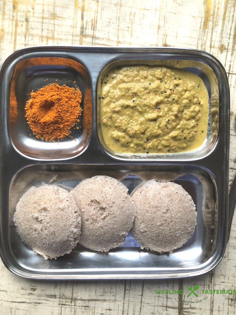 Ragi Idli is a fermented Idli (steamed savoury breakfast) made with Finger Millet and Lentils. Served with Sambhar & chutney as Breakfast / Snack
