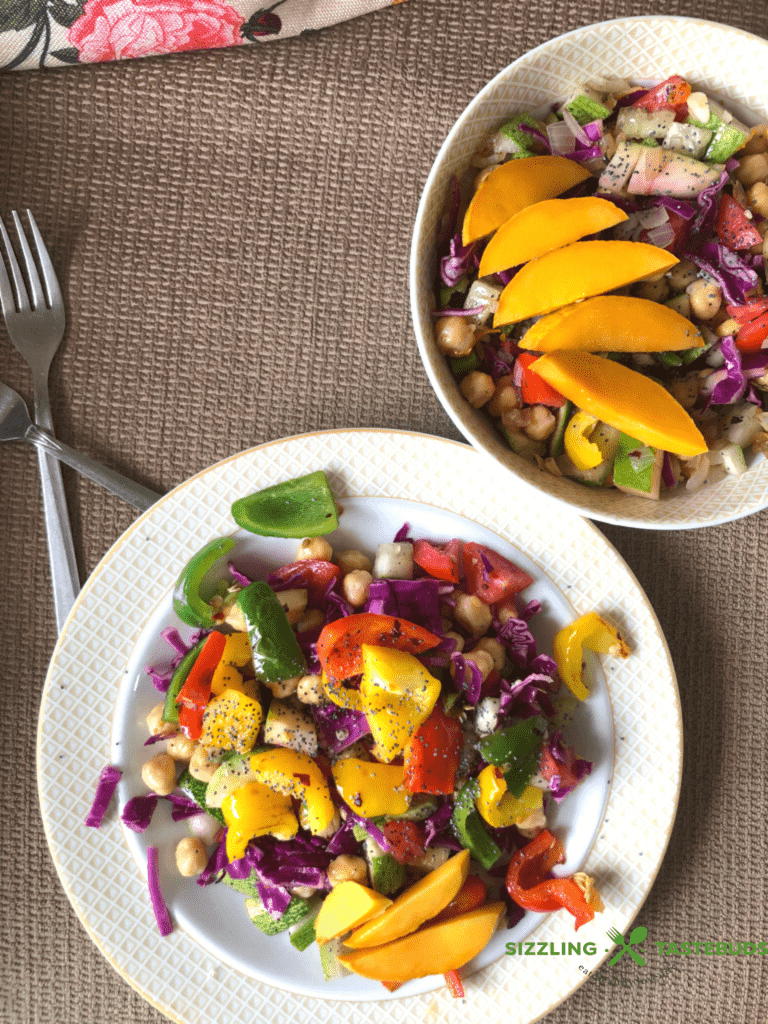 Roasted Peppers Chickpeas and Mango Salad is a light, delicious Gluten Free and Vegan Summery salad that comes together in minutes and feeds a crowd! 