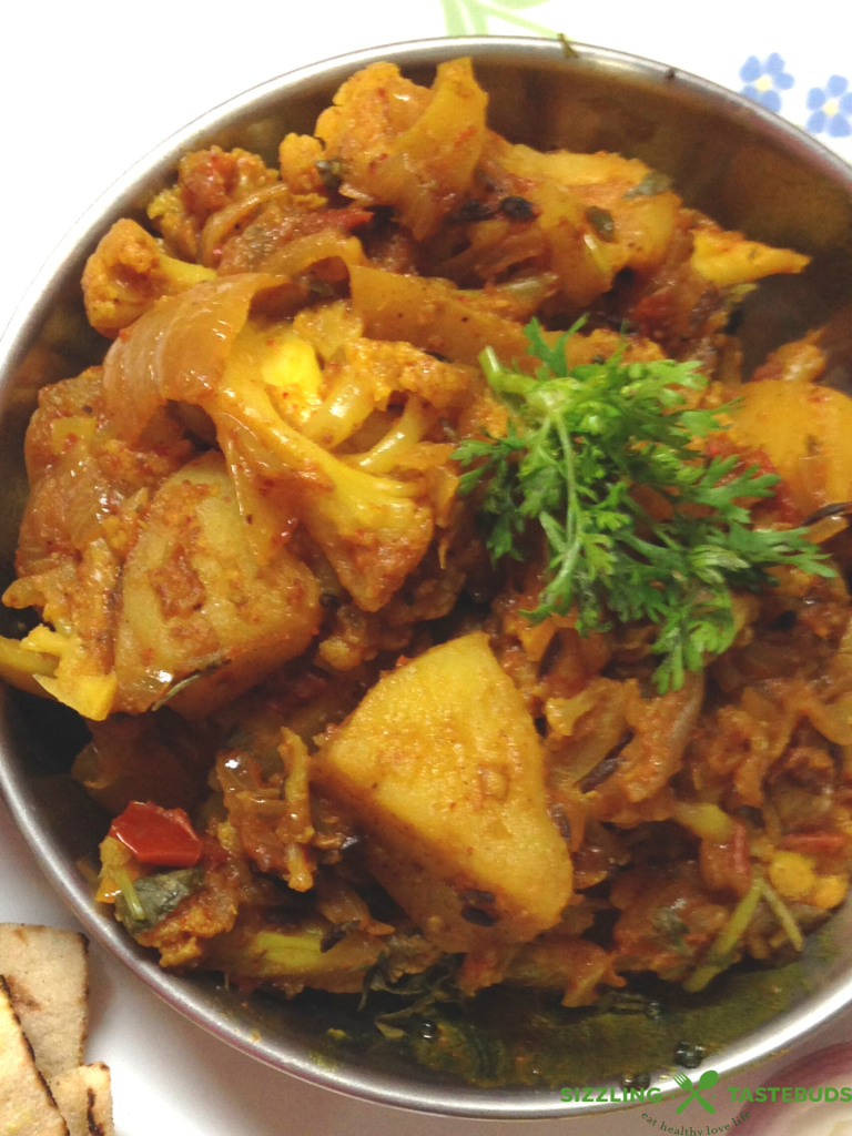 Homestyle Vegan and Gluten Free Aloo Gobhi (Potato- Cauliflower stir fry) made with basic kitchen spices. Also sometimes called Alu Gobhi ki Sabji or Gobhi-Aloo