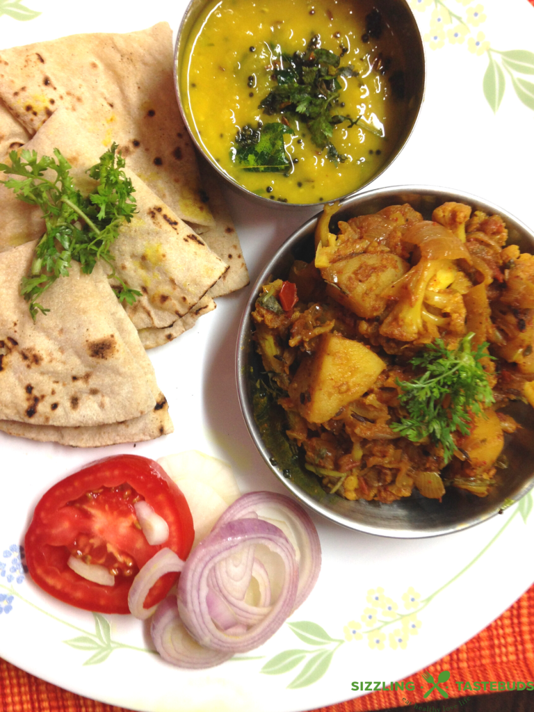Homestyle Vegan and Gluten Free Aloo Gobhi (Potato- Cauliflower stir fry) made with basic kitchen spices. Also sometimes called Alu Gobhi ki Sabji or Gobhi-Aloo
