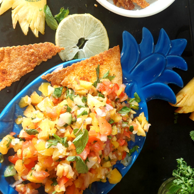 Roasted Pineapple Salsa is a delicious salsa made with roasted pineapples, seasonal fruit and a basic dressing. Perfect as an appetiser / side for parties or potluck