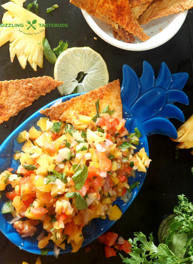 Roasted Pineapple Salsa is a delicious salsa made with roasted pineapples, seasonal fruit and a basic dressing. Perfect as an appetiser / side for parties or potluck