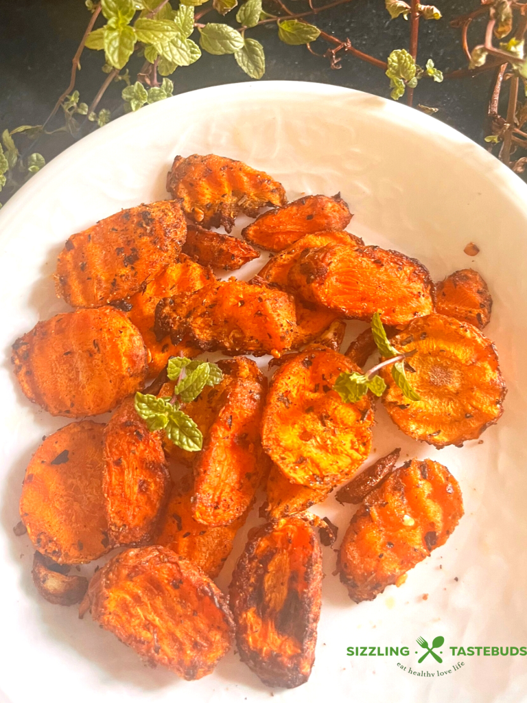 Garlic and Mint come together with carrots in this fuss free, Vegan + GF delicious dish that is made in minutes in an air fryer. Serve as a side or enjoy as a meal !  