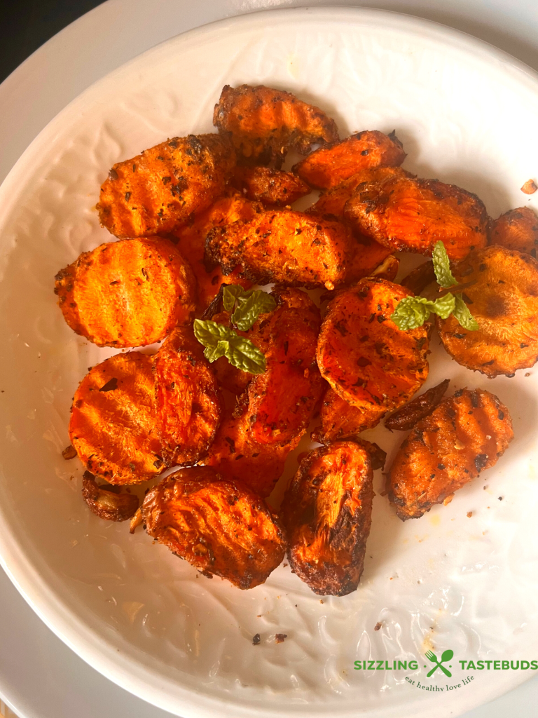 Garlic and Mint come together with carrots in this fuss free, Vegan + GF delicious dish that is made in minutes in an air fryer. Serve as a side or enjoy as a meal !   
