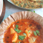 Railway Style Aloo Bhaji is a no-onion and no-garlic quick curry served with any flatbread like Poori , Kachori or Paratha. It is a delicious meal that works well on long train journeys too.