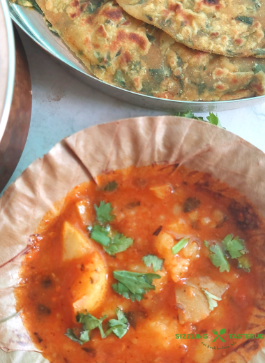 Railway Style Aloo Bhaji is a no-onion and no-garlic quick curry served with any flatbread like Poori , Kachori or Paratha. It is a delicious meal that works well on long train journeys too.