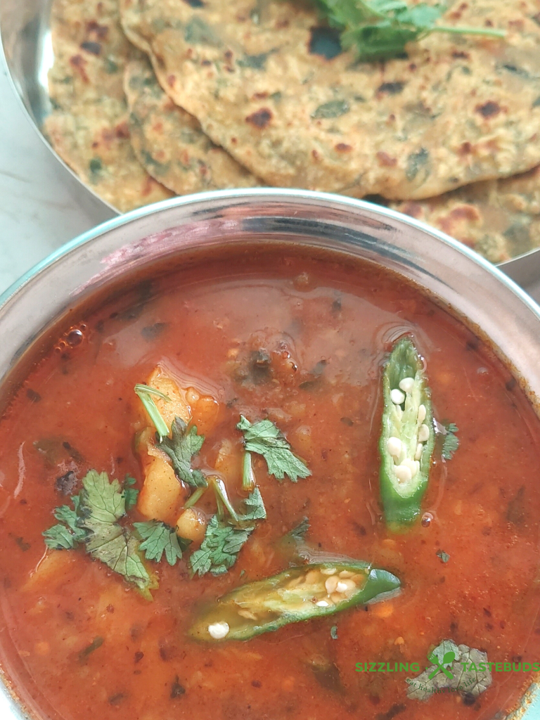 Railway Style Aloo Bhaji is a no-onion and no-garlic quick curry served with any flatbread like Poori , Kachori or Paratha. It is a delicious meal that works well on long train journeys too.