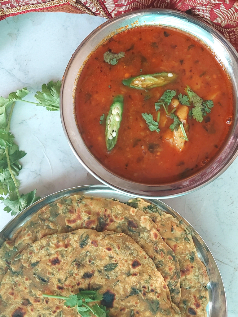 Railway Style Aloo Bhaji is a no-onion and no-garlic quick curry served with any flatbread like Poori , Kachori or Paratha. It is a delicious meal that works well on long train journeys too.