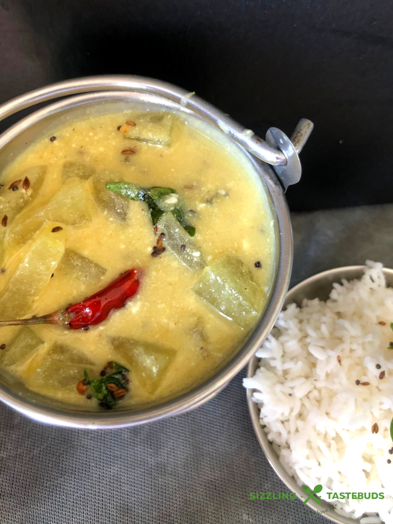 Kumbalakayi majjigehuli is ashgourd yoghurt curry made in Karnataka cuisine. Served with hot steamed rice and a dry saute on the side.