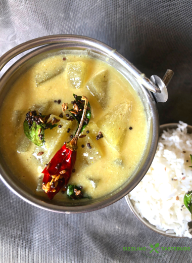 Kumbalakayi majjigehuli is ashgourd yoghurt curry made in Karnataka cuisine. Served with hot steamed rice and a dry saute on the side.