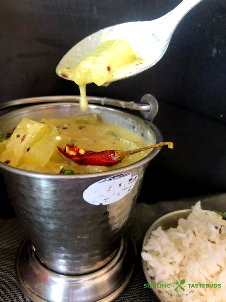 Kumbalakayi majjigehuli is ashgourd yoghurt curry made in Karnataka cuisine. Served with hot steamed rice and a dry saute on the side.