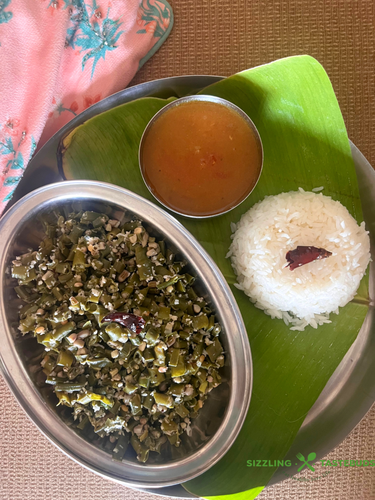 Achinga Payar Thoran refers to a no onion no garlic stir fry with long yard beans, tempered with coconut. Usually served with Rice + Sambhar or Rasam