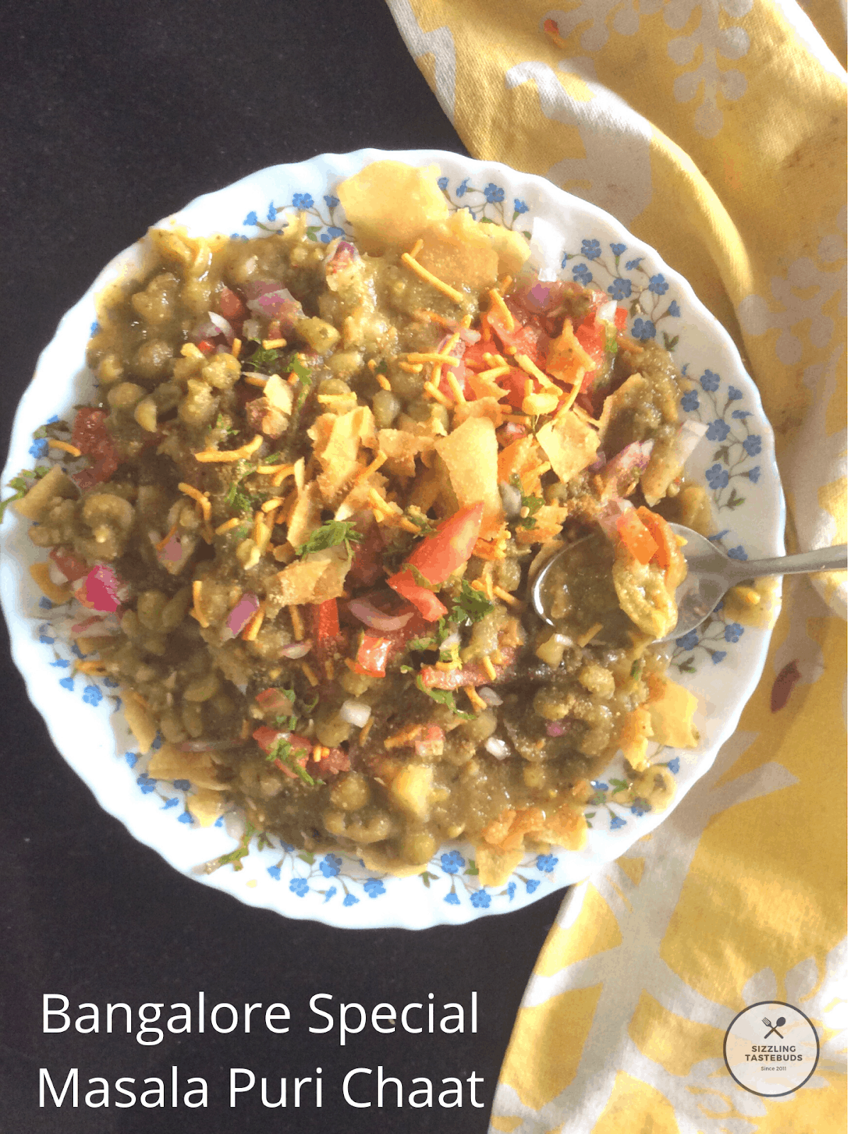 Masala Puri or Masaal Puri is an iconic Street food or Chaat dish made in and around Bangalore. It is a delicious chaat made with soaked and cooked legumes served with a variety of condiments.