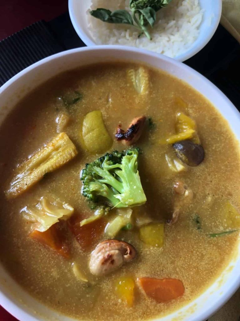 Homemade Yellow Thai Curry with Mango and loaded with veggies is a delicious curry served with sticky rice / Jasmine Rice as a complete meal
