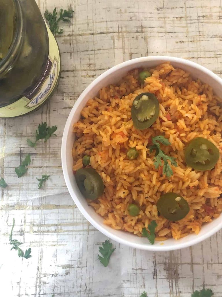 Quick and easy Mexican Fried rice is a gluten Free, Vegan One Pot meal that works well for parties and lunchboxes alike. 
